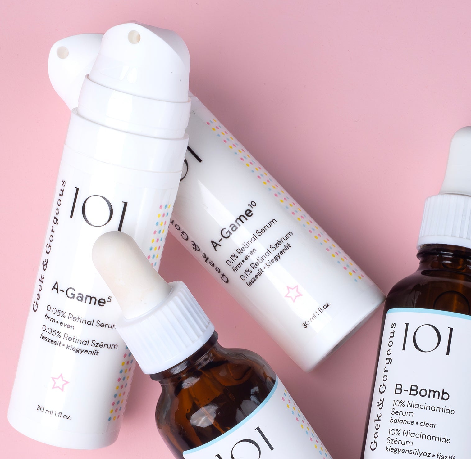 Geek & Gorgeous A-Game and other serums displayed with a pink background
