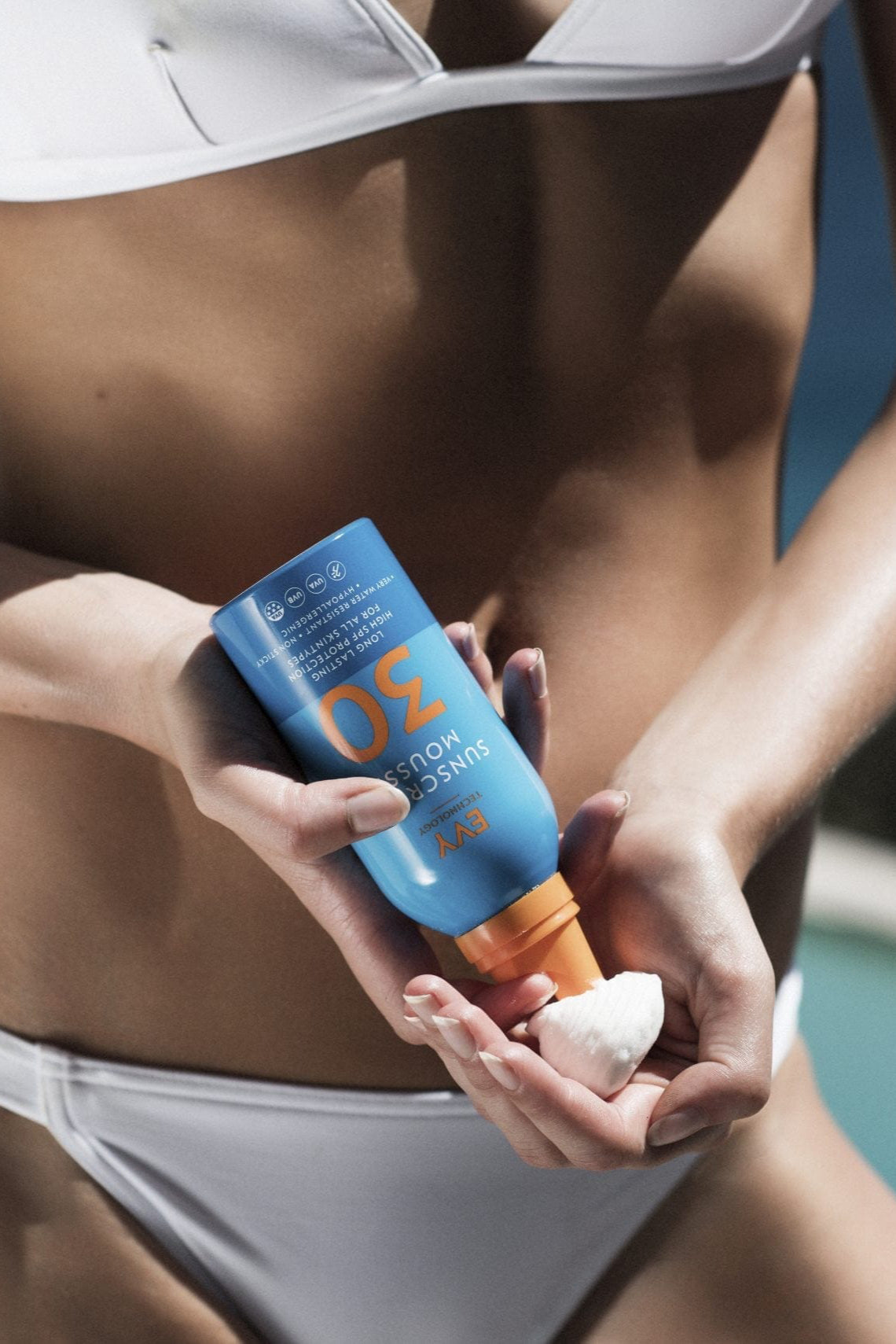 Evy Technology Sunscreen Mousse SPF30 foam with model