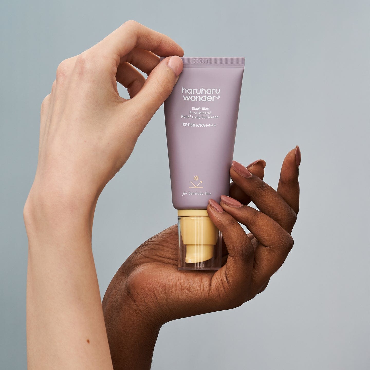 Haruharu wonder black rice pure mineral relief daily sunscreen hands holding