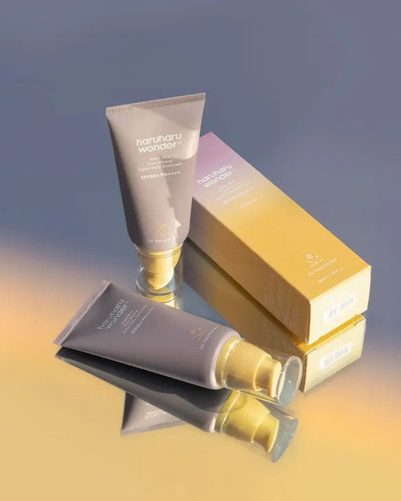 Rice Pure Mineral Relief Daily Sunscreen duo set laying down in a mirror