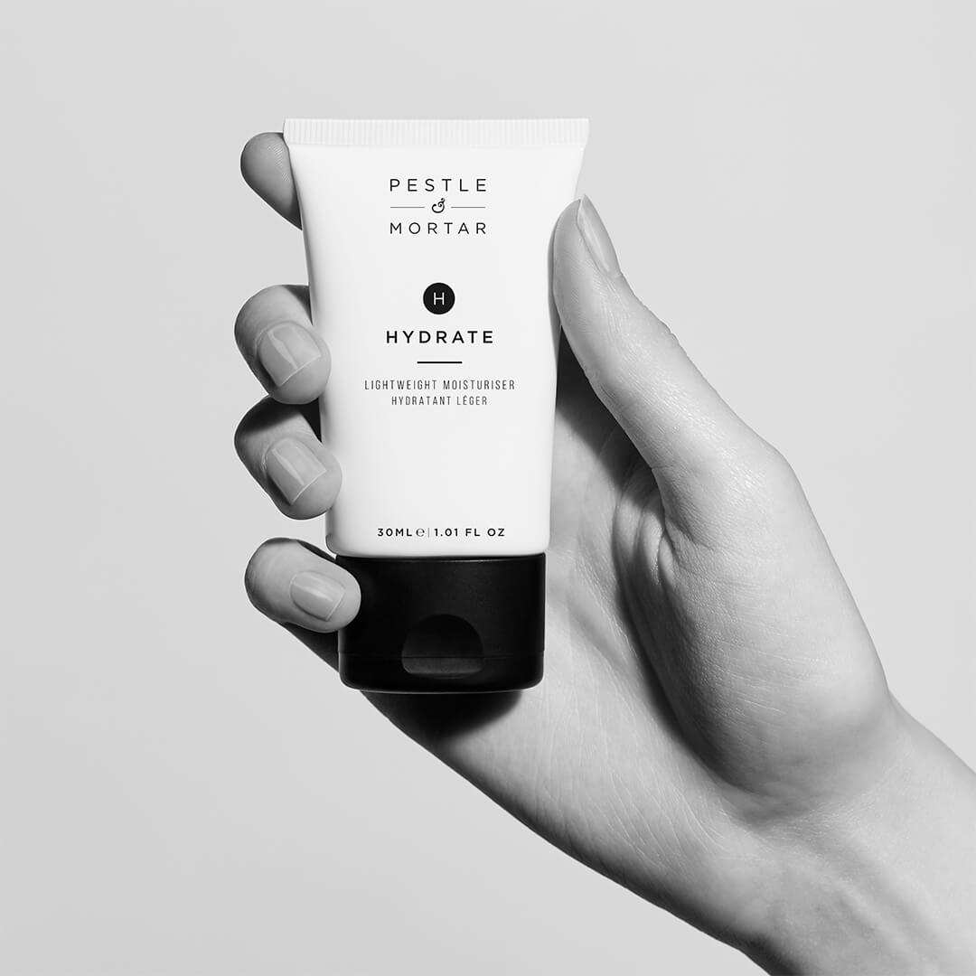 Hydrate moisturiser 30ml in hand