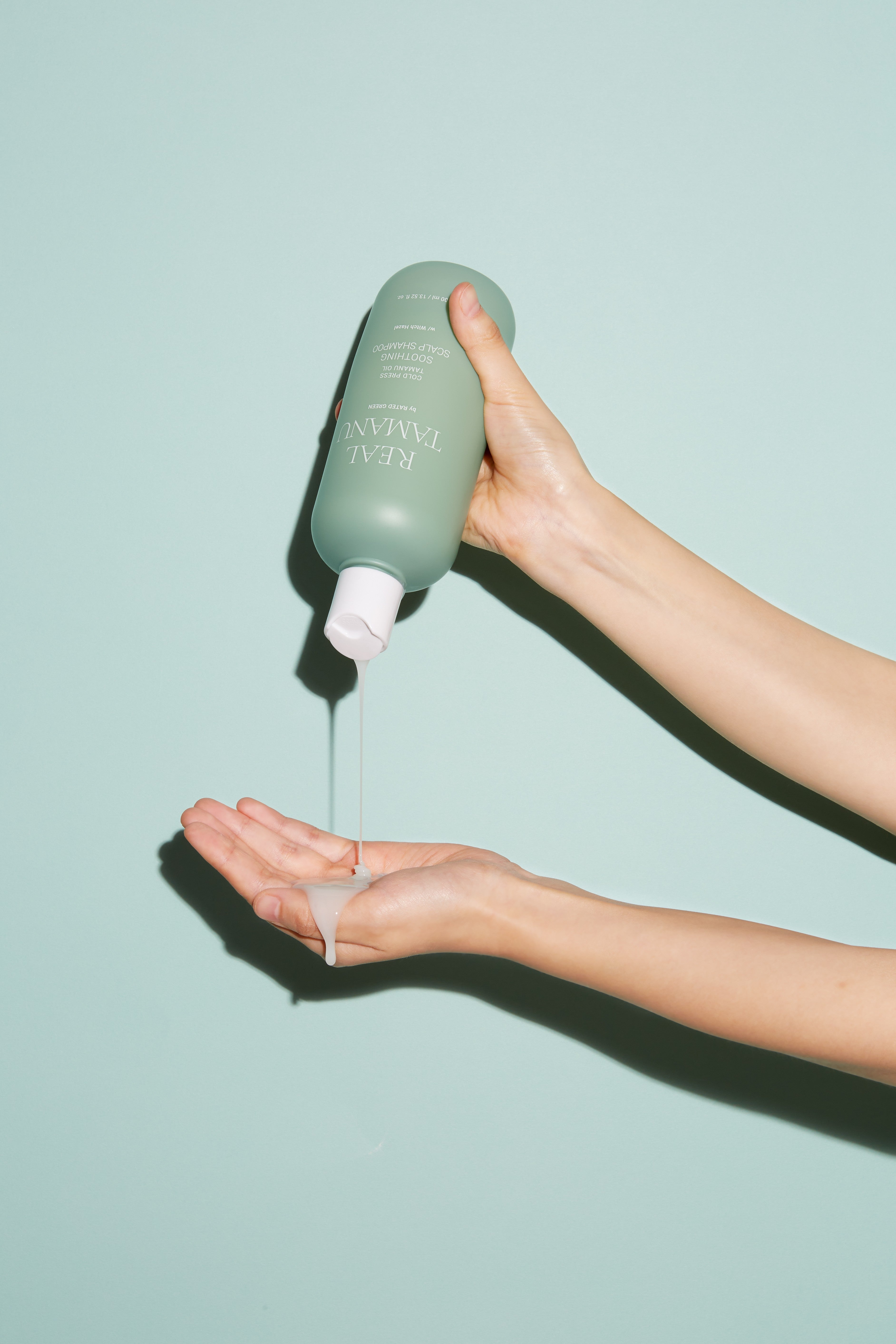 Rated Green Real Tamanu Soothing Scalp Shampoo Model Hand Texture