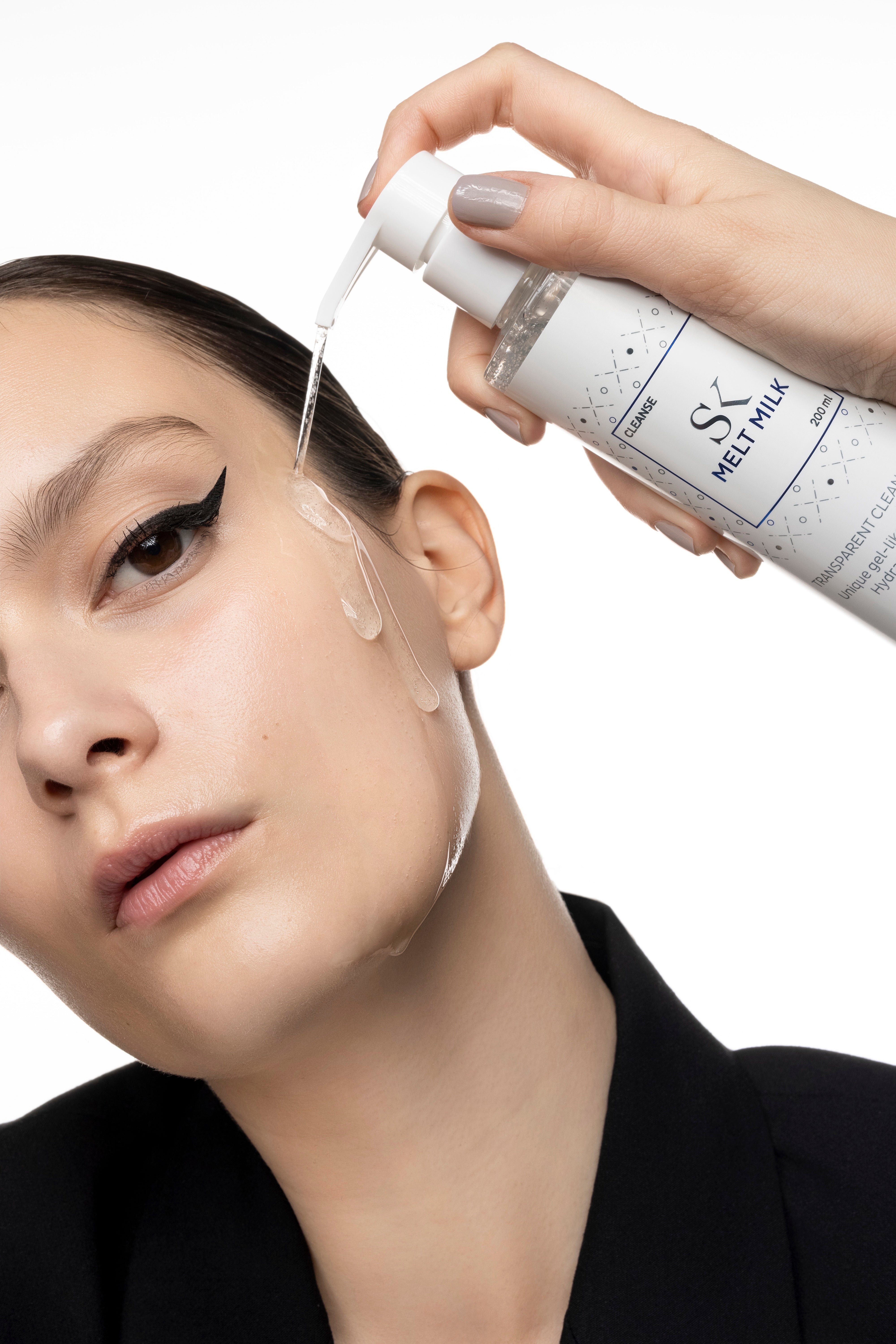 Skintegra Melt Milk Cleanser Model and Texture 