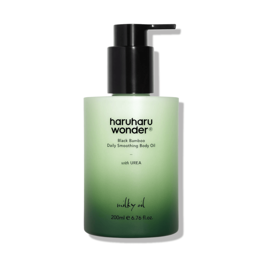 Green bottle of haruharu wonder body oil with pump on a white background